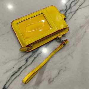 Lodis wristlet in yellow and pink accent vegan leather.
